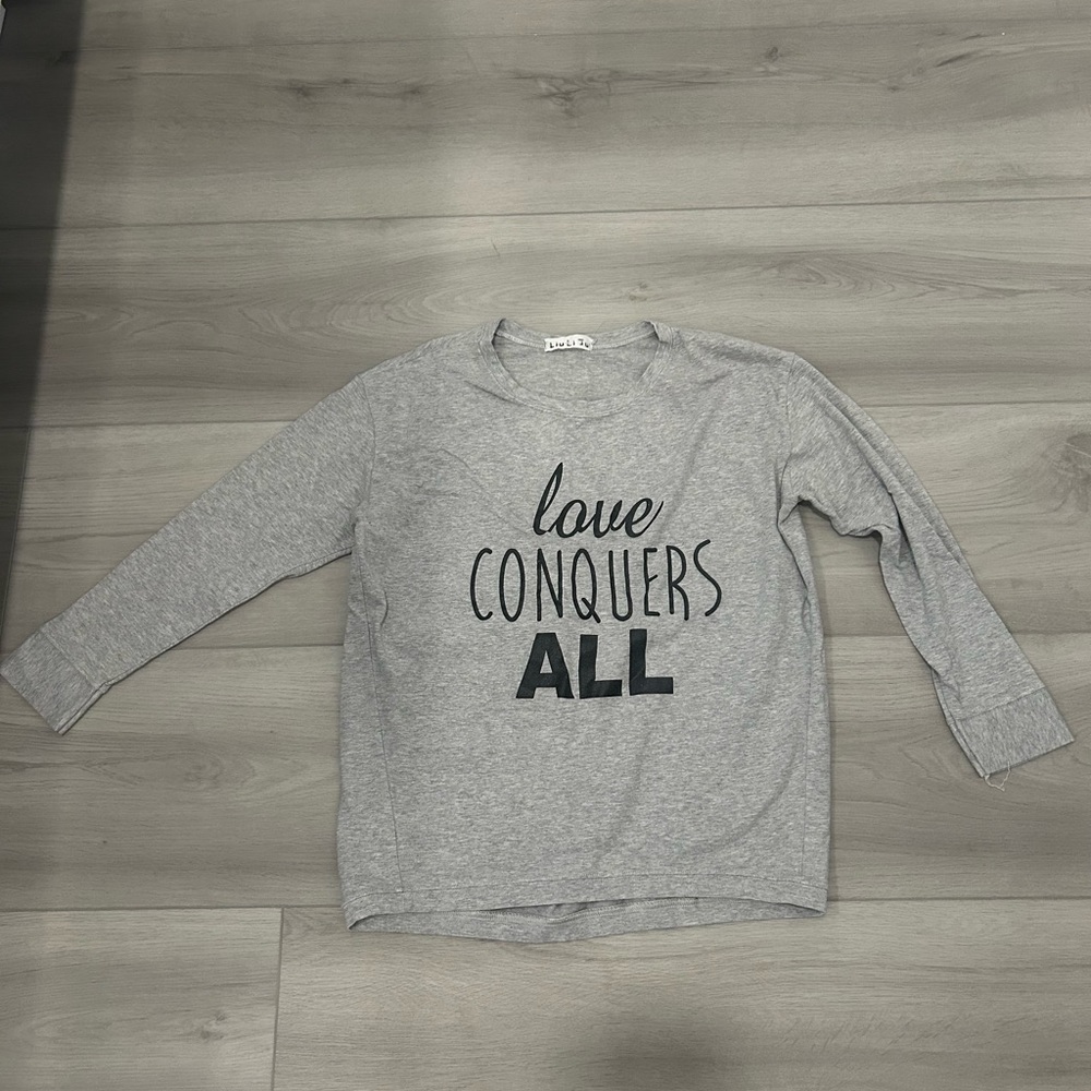 “Love conquers all” Long Sleeve